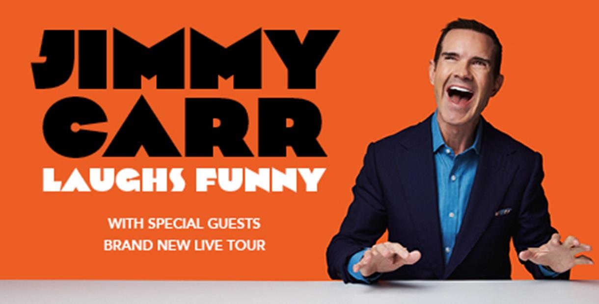 Jimmy Carr against an orange background