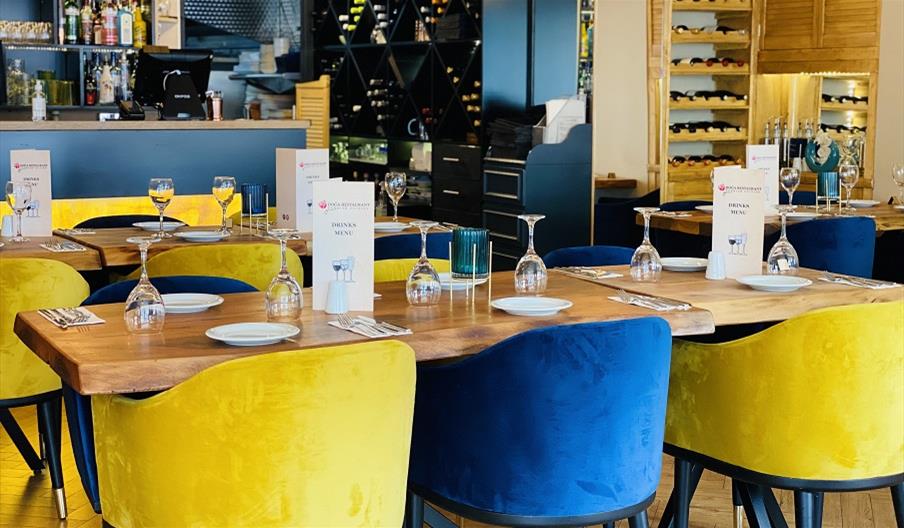 Interior of Doga Restaurant with yellow and blue chairs