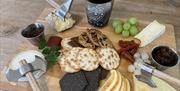 Cheeseboard with crackers and a variety of cheeses