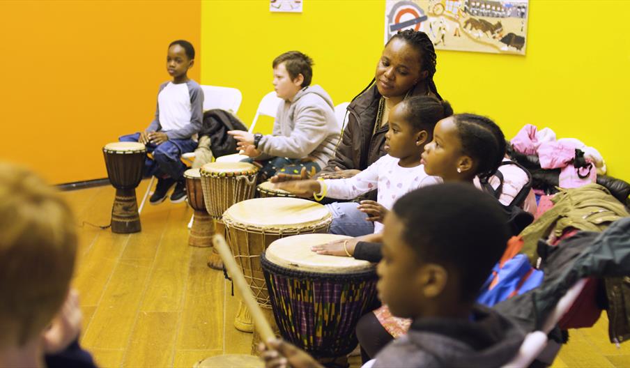 Children playing on African drums