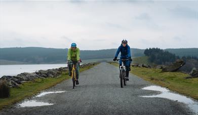 Two cyclist riding side by side