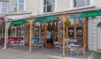 Outside of the Irish Bar with seating