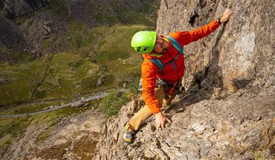 Man climbing rock face