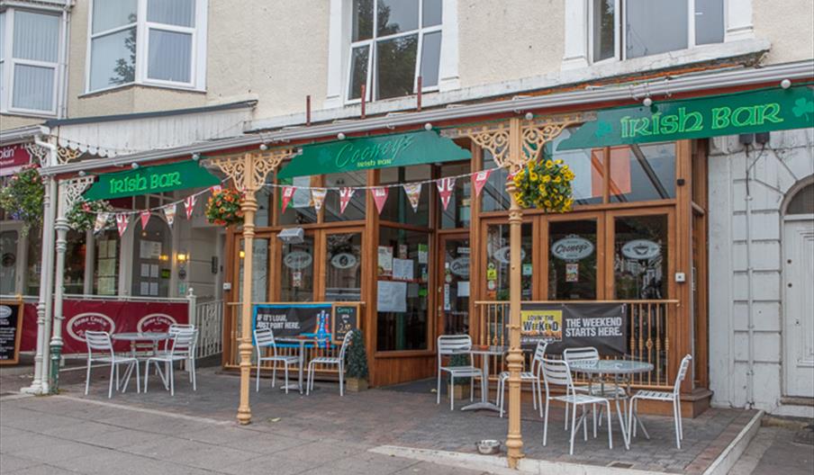 Outside of the Irish Bar with seating