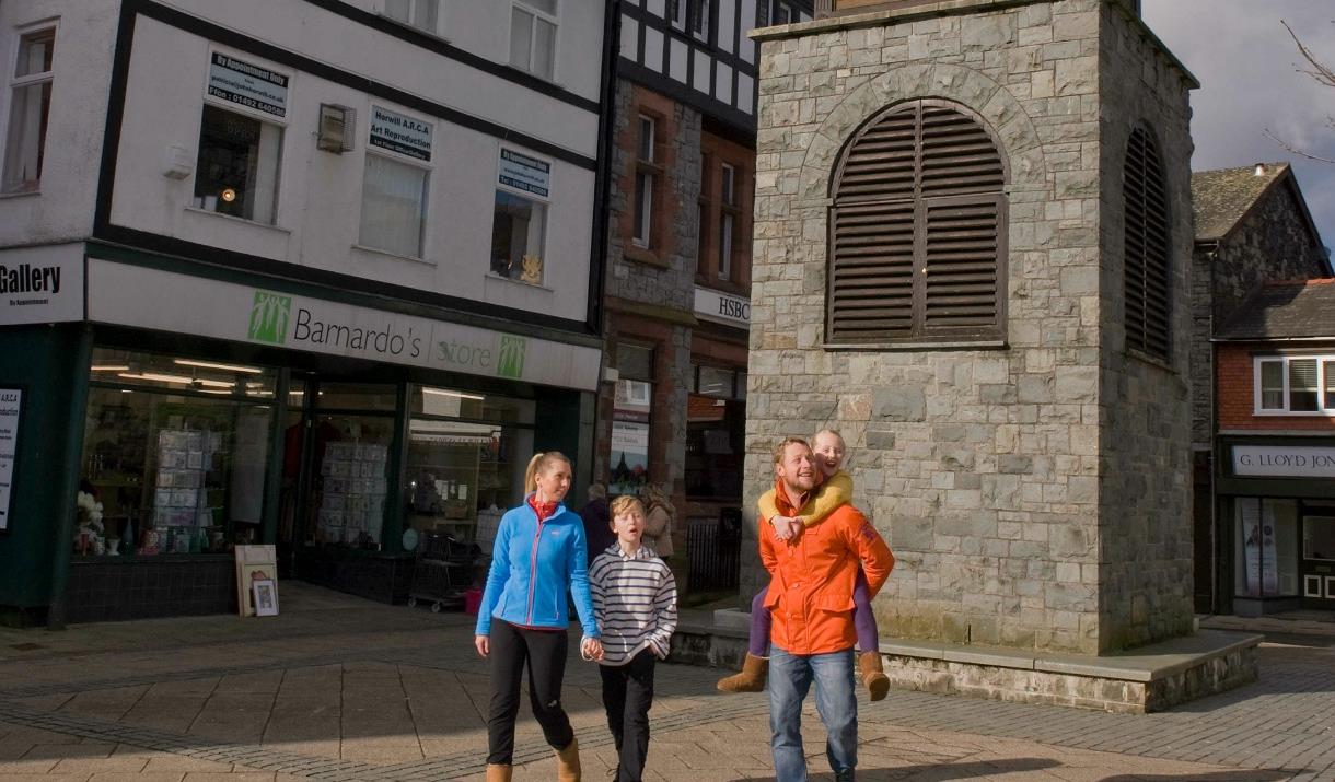 A family walking in Ancaster Square, Llanrwst