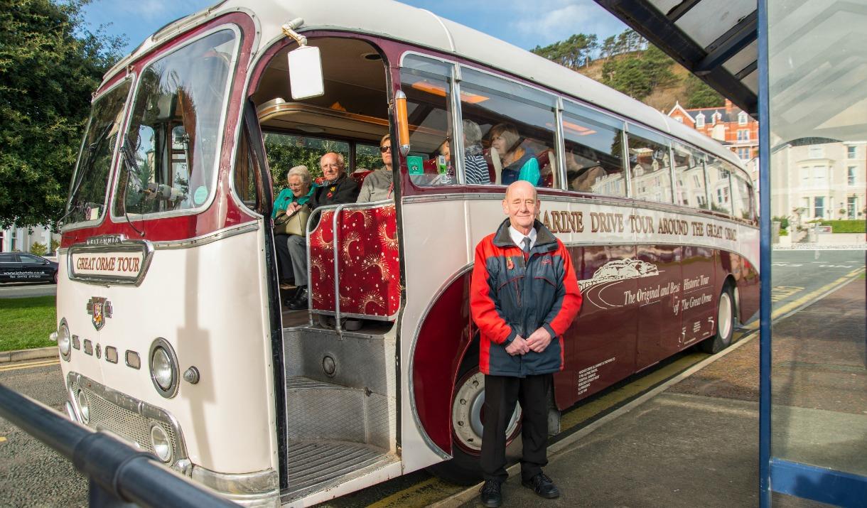 Bus driver stood outside the Marine Drive tour bus