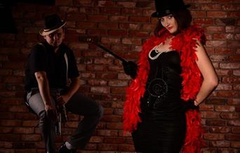 Man and woman in cabaret outfits