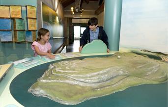 Two children looking at the Great Orme model, Great Orme Country Park