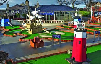 Pirate ship and lighthouse holes of crazy golf course