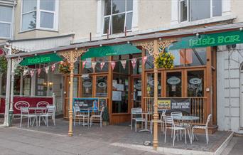 Outside of the Irish Bar with seating