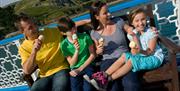 Family enjoying ice cream on Llandudno Pier
