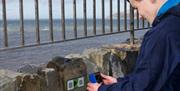 Person scanning QR code on a phone