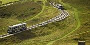 Two trams travelling on the Orme