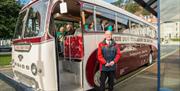 Bus driver stood outside the Marine Drive tour bus