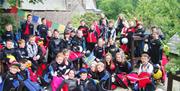 Large group of children wearing wetsuits