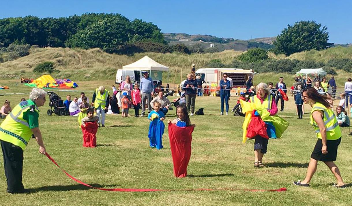 Children in a sack race at Deganwy Prom Day