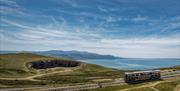 The Llandudno tramway with Conwy Bay and the mountains of Snowdonia in the background