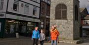A family walking in Ancaster Square, Llanrwst