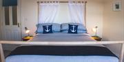 Image of bedroom with double bed and nautical theme