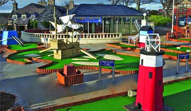 Pirate ship and lighthouse holes of crazy golf course