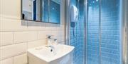 Blue tiled en suite bathroom, Beachside Guesthouse