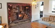 Fireplace inside Glan Dwr Holiday Cottage