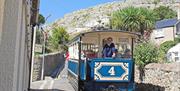 The tram heading down a narrow street on the Great Orme