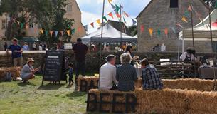 beer festival view of farmyard and bunting at cogges manor farm 