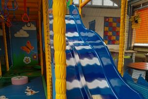 Soft play equipment including the slide