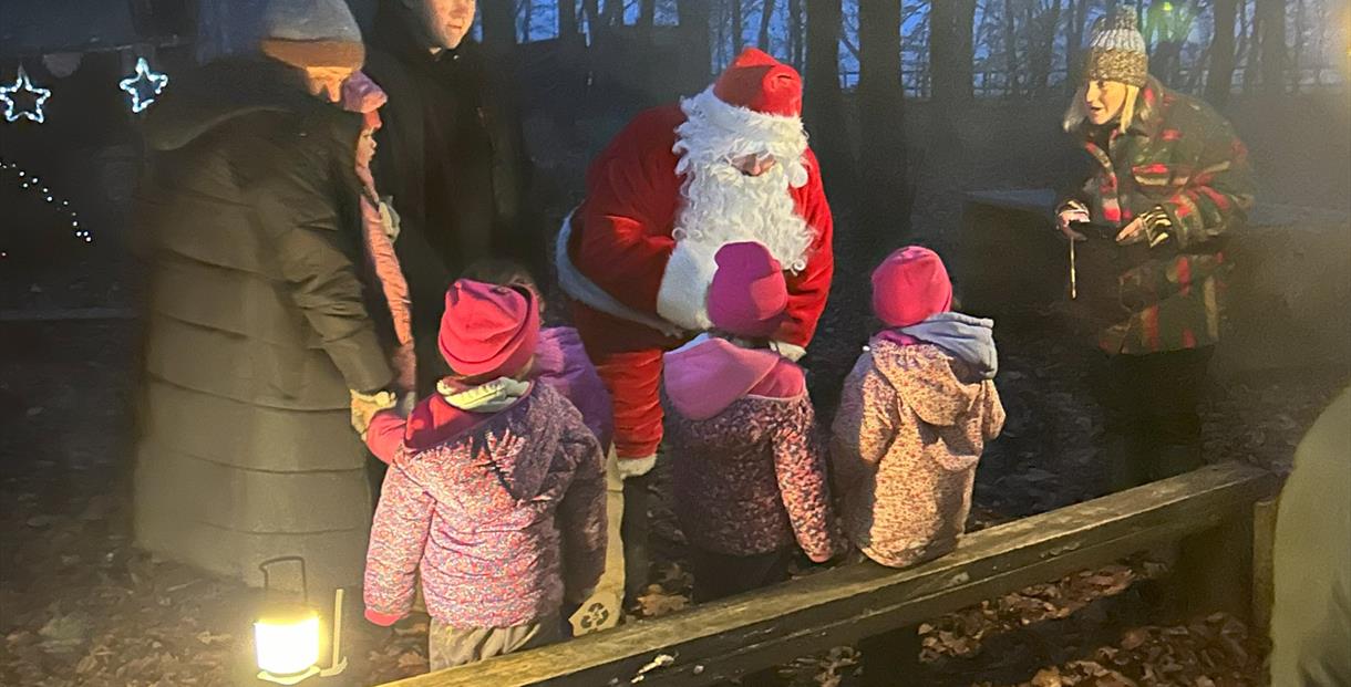 Santa meets children around the campfire at Fat Squirrel Outdoor