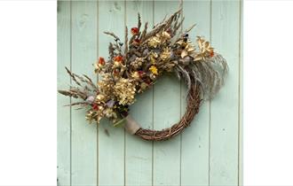 All natural wreath on a wooden door