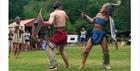 A female gladiator and male gladiator fighting at Chedworth Roman Villa