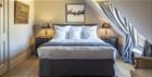Stylish bedroom at Poulton Hill