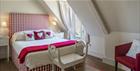 Red and white bedroom at Poulton Hill