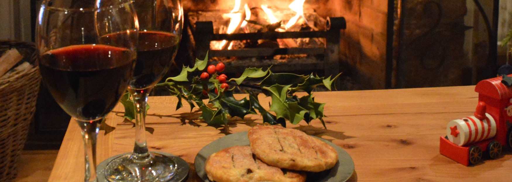A warming drink and pastry by the open fire at Heath Farm Holiday Cottages