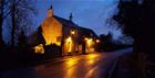 This photo shows The Trout Inn from the roadside, this photo was taken in the evening.