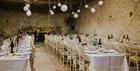 The Barn at Cogges Manor Farm set for a wedding (photo - Alexis Jaworski)