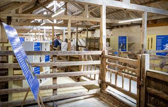 Items and information panels on display in old farm buildings at the National Trust Heritage and Rural Skills Centre