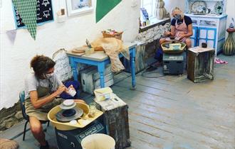 At the potters wheel - Eastnor Pottery