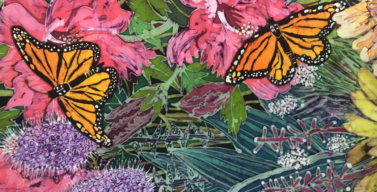 Batik artwork featuring flowers and two butterflies