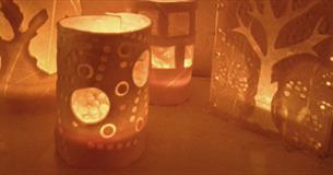 Four lit porcelain paperclay lanterns