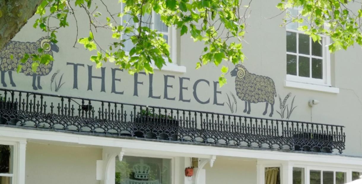 Image of the outside of The Fleece, drawings of sheep next to the name.