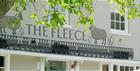 Image of the outside of The Fleece, drawings of sheep next to the name.