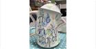 A jug with the words 'The Funky Teapot' written on it