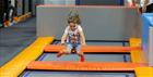 A child jumping in the trampoline park