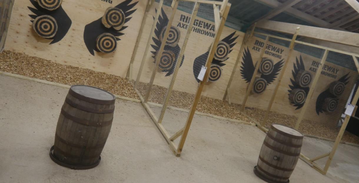 The axe throwing range with targets on the wall