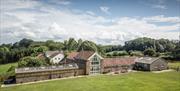 Lodge Barn - aerial view of the generous outdoor space, quiet rural location and spacious accommodation at Lodge Barn