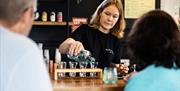 person pouring gin for sampling @ Silver Circle Distillery