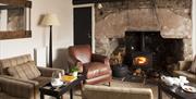 Lounge with wood burner at Tudor Farmhouse