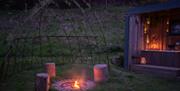 The Nest Luxury Glamping fire pit at night